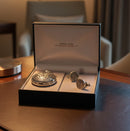 Silver pocket watch and cufflinks set in a branded box