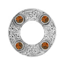 Dancers Celtic Plaid Brooch displayed elegantly on fabric, demonstrating its unique plaid pattern and artisan detail.