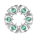 Artisan-crafted Dancers Thistle Plaid Brooch resting on a flat surface, highlighting its 2 1/4" diameter and delicate design.