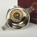 Elliot Clan Crest Quaich with Gold Trim, showcasing a traditional Scottish cup of friendship made from high-quality Pewter, featuring a gold plated insert around the approved Clan crest, available in two sizes and presented in an attractive box.