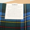 Stylish Wool Scarf in Cockburn Tartan displayed, highlighting its vibrant colors and lightweight wool material, ideal for adding a touch of elegance to any outfit.