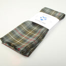 Luxury Lightweight Scarf in MacKenzie Weathered Tartan draped over a fashion model showcasing its elegant design and versatility.