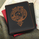 black notebook with a clan crest on a textured surface