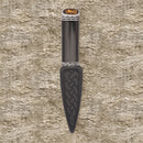 Torridon Blackwood Sgian Dubh with Stone Top featuring a hand carved blackwood handle and Celtic pewter mounts, displayed in a black presentation box.