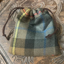 Tartan Gift Bags featuring customizable tartan designs perfect for wedding favors, crafted with leather drawstrings and fully lined for a premium finish.