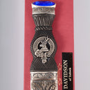Close-up of the Davidson Clan Crest Sgian Dubh, featuring the gold foil backed stone and traditional pewter metalwork.