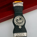 Zoomed detail of the MacDonald Clan Crest Sgian Dubh - Stone Top featuring traditional thistle metalwork and gold foil backing.
