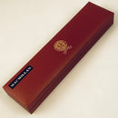 Close-up view of the MacMillan Clan Crest Sgian Dubh, highlighting the gold foil backed stone and traditional Scottish craftsmanship.
