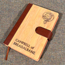 Close-up of the Clan Crest Luxury Bamboo Covered Notebook Boxed Set showing detailed laser engraving of the clan crest.