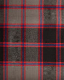 Heavy Weight Tartan per meter fabric on a sewing table, ideal for making garments and home decor, now available at a discounted price.